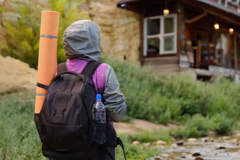 Backpacker approaching a guesthouse