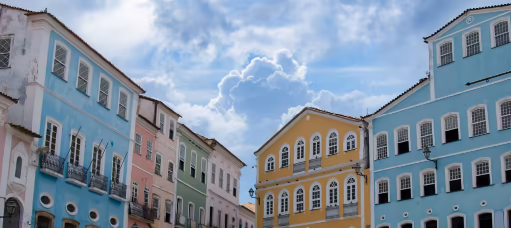 Brazil cultural heritage: pastel colonial facades with rows of tall windows and iron balconies in Pelourinho, Salvador